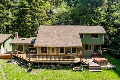 Perched among the trees on 3.24 private acres, this inviting - photo 2