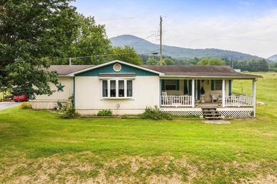 Pasture setting and Mountain Backdrop awaits at this 4.2-acre