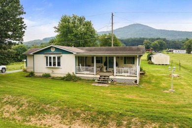 Pasture setting and Mountain Backdrop awaits at this 4.2-acre
