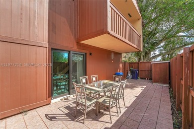 Tucked within the lush, gated community of Snapper Village, this - photo 13