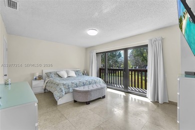 Tucked within the lush, gated community of Snapper Village, this - photo 17
