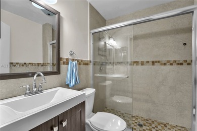 Tucked within the lush, gated community of Snapper Village, this - photo 20