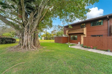 Tucked within the lush, gated community of Snapper Village, this - photo 25