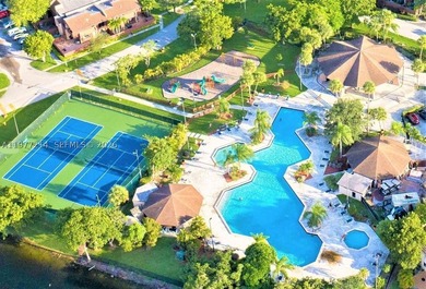 Tucked within the lush, gated community of Snapper Village, this - photo 26