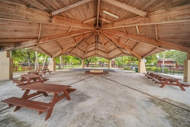 Tucked within the lush, gated community of Snapper Village, this - photo 27