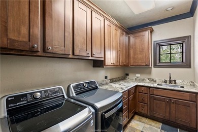 This custom estate sits on a rare 1.4-acre wooded lot backing to - photo 32