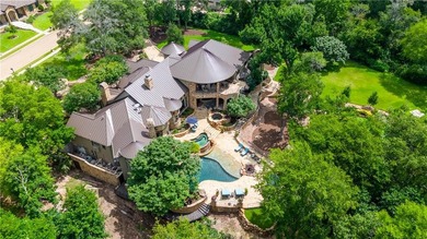 This custom estate sits on a rare 1.4-acre wooded lot backing to - photo 45