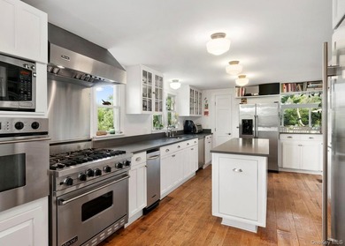 A rare and compelling offering along coveted Dune Road, this - photo 11