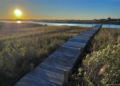 A rare and compelling offering along coveted Dune Road, this - photo 23