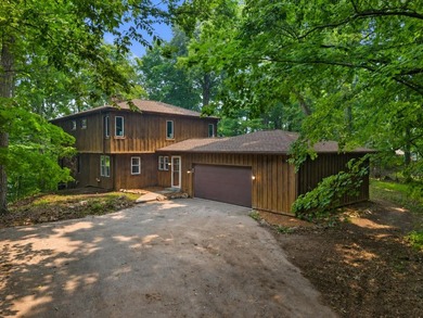 Perched on a private wooded hill with seasonal views of Silver - photo 1