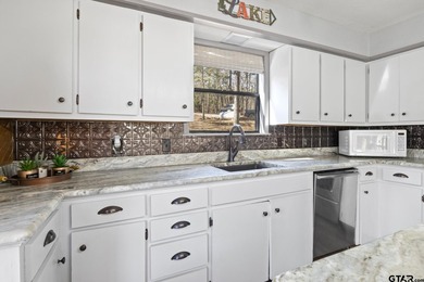SELLER IS OFFERING $20,000 REMODEL ALLOWANCE. Tucked away on the - photo 12