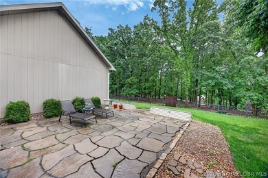 Set on a beautifully landscaped, nearly one-acre lot in The - photo 12