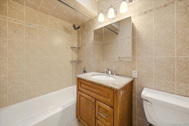 Welcome to this charming two-family Colonial-style duplex in the - photo 10