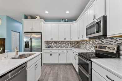 Experience low-maintenance living in LakePark at Tradition, an - photo 11