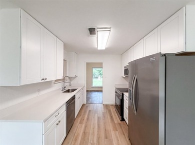 Welcome to 7928 Ella Young Dr, where fresh interior paint - photo 2