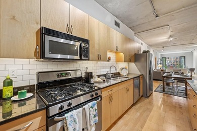 Welcome to 212 Lofts, where city living feels open, bright, and - photo 12