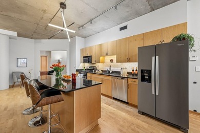 Welcome to 212 Lofts, where city living feels open, bright, and - photo 13