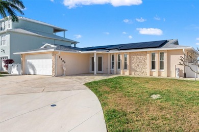 This beautifully updated Gulf Harbors waterfront home delivers