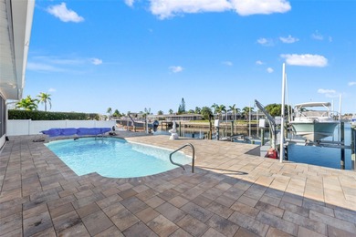 This beautifully updated Gulf Harbors waterfront home delivers