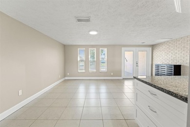 This beautifully updated Gulf Harbors waterfront home delivers