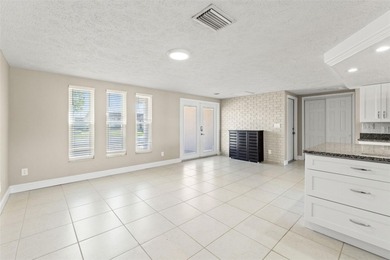 This beautifully updated Gulf Harbors waterfront home delivers