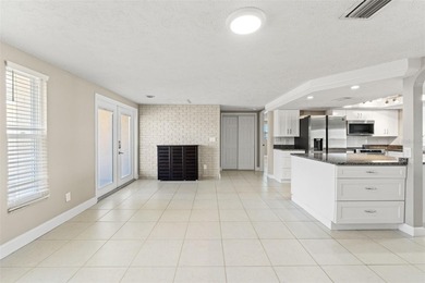 This beautifully updated Gulf Harbors waterfront home delivers