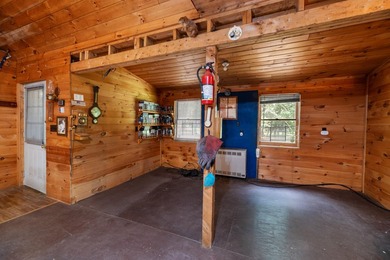 Tucked away on a private lot, this charming camp offers the - photo 8