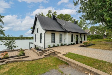 Lake Home For Sale in Mont-Saint-Hilaire, 
