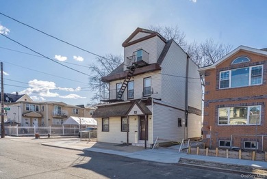 Welcome to this unique three-family home, a strong income - photo 2