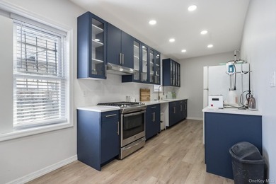 Welcome to this unique three-family home, a strong income - photo 8