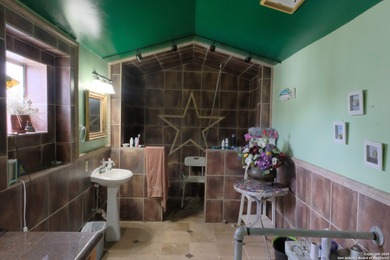 Located in Marion, this charming farmhouse sits on 25.7 acres of