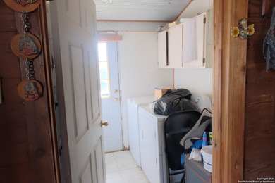 Located in Marion, this charming farmhouse sits on 25.7 acres of