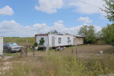 Located in Marion, this charming farmhouse sits on 25.7 acres of