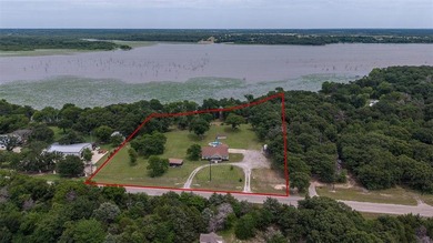 Experience luxury lake living in this stunning custom built - photo 2