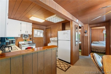Tucked away on the sought-after Little Niangua Arm, this 3 bed - photo 13