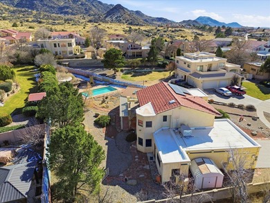 Situated on a .38 acre lot in the Sandia Foothills, this home is