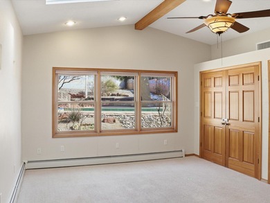 Situated on a .38 acre lot in the Sandia Foothills, this home is