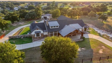 Welcome to 117 Hansma Way, a breathtaking custom ranch estate in