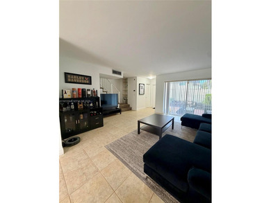 Welcome to this charming condominium located at 8785 SW 137th