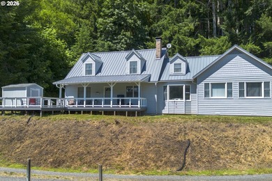 Two homes on over 7 riverfront acres! The 1983 home is 3 bedroom - photo 1