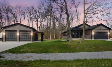 Set within the gated community of Lake Waynoka, this refined - photo 1
