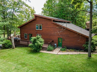 This visually stunning, premier lakefront log home on a - photo 2