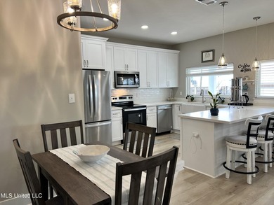 Wake up to coastal breezes and water views in this beautiful - photo 19