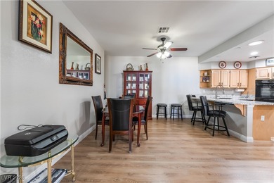 A rare single-story townhome in the gated Promenade at the