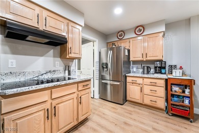 A rare single-story townhome in the gated Promenade at the