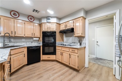 A rare single-story townhome in the gated Promenade at the