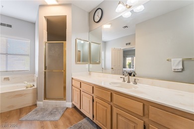 A rare single-story townhome in the gated Promenade at the