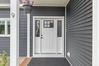 This home features a spacious first-floor primary suite with a - photo 3