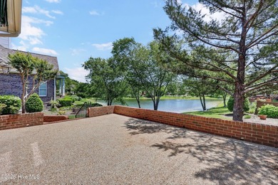 Nestled on a peaceful pond in the gated community of Landfall - photo 2