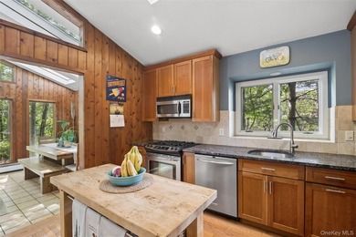 Tucked away among towering trees in the heart of Miller Place - photo 18